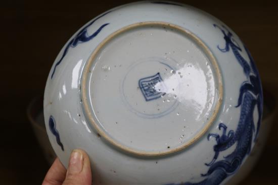 A Qianlong famille rose bowl and three blue and white plates